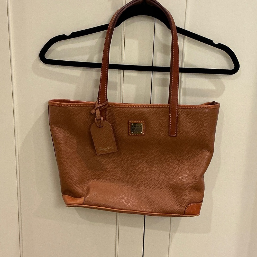 Dooney & Bourke Pebbled brown leather tote.